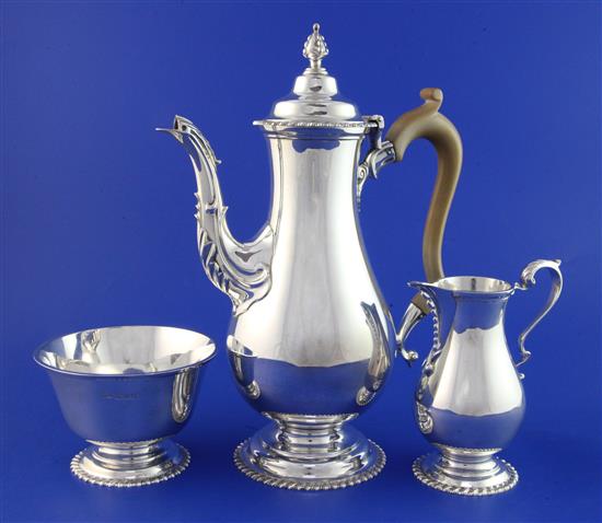 A 1960s 18th century style silver three-piece coffee set by Mappin & Webb, gross 36.5 oz.